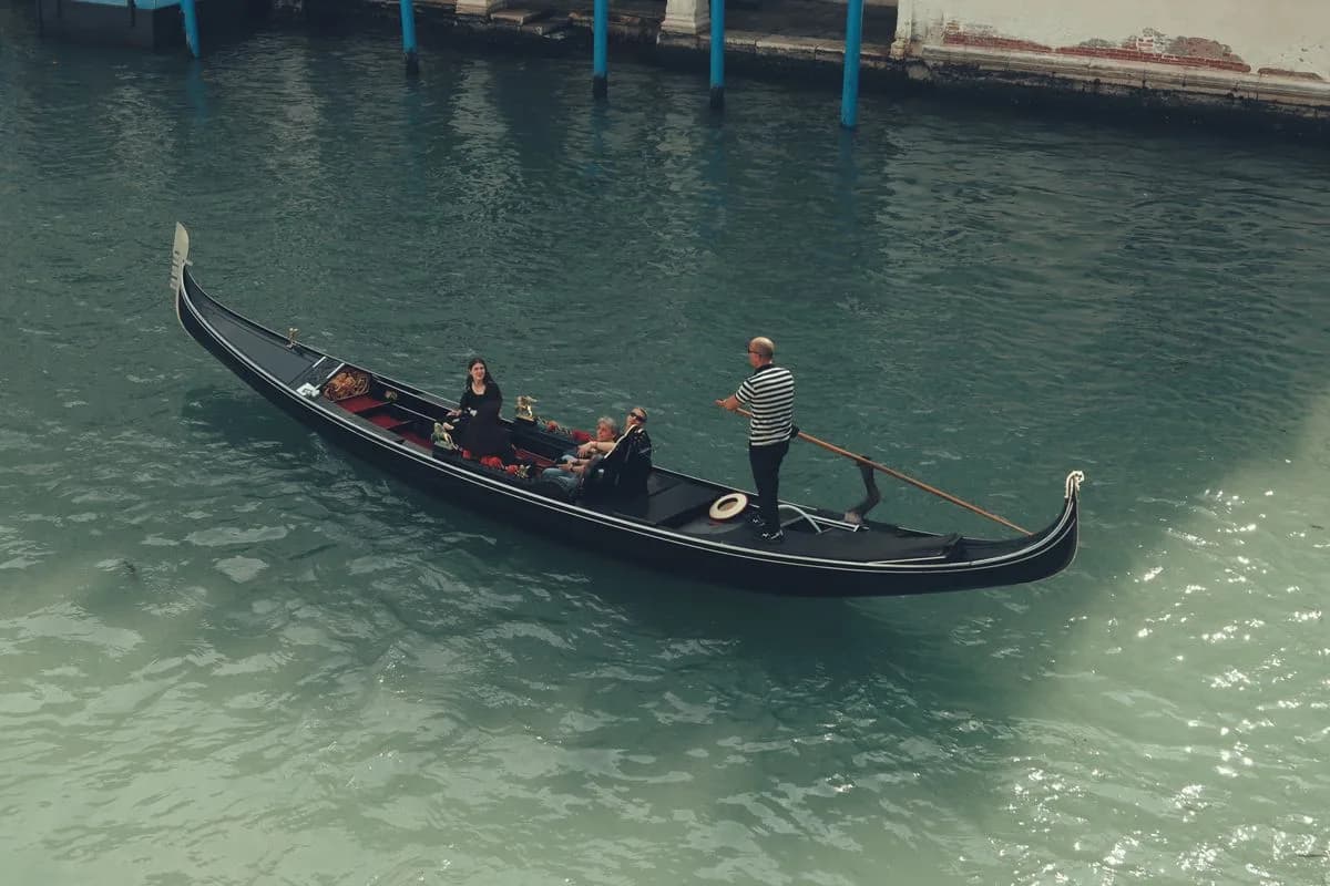 A gondola crossing a Venetian canal