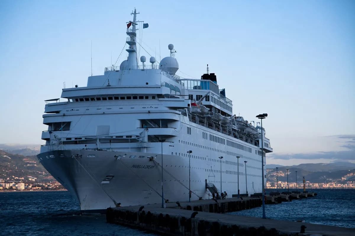 A luxury cruise ship at the pier in early light