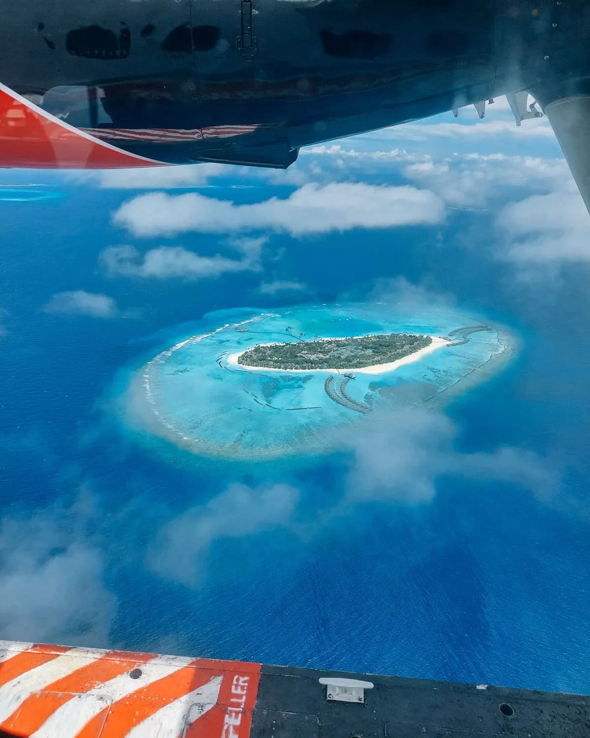 An island seen from the window of a seaplane